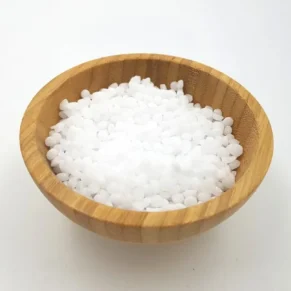 Alt Text: A close-up image of a bowl of cetyl alcohol, a white solid wax-like substance commonly used in skincare formulations.[Cetyl alcohol] [organicsbyjumira]