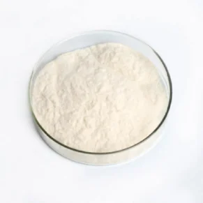 Alt Text: A bowl of Kojic Acid powder - an effective ingredient in skincare formulations. Harness the power of Kojic Acid for brighter, even-toned skin. Visit OrganicsbyJumira for high-quality skincare products. Boost your skincare routine with Kojic Acid powder! For more, visit https://organicsbyjumira.com/