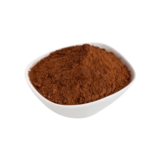 “Organic cocoa powder in a white bowl, used in skincare formulations. Visit https://organicsbyjumira.com/ for more information.”