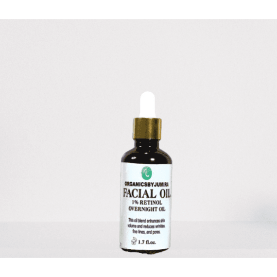 "Organicsbyjumira 1% Retinol Overnight Facial Oil bottle with a dropper, surrounded by key ingredients such as jojoba oil, lavender oil, and rosehip oil, showcasing the natural and organic skincare formulation."