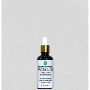 "Organicsbyjumira 1% Retinol Overnight Facial Oil bottle with a dropper, surrounded by key ingredients such as jojoba oil, lavender oil, and rosehip oil, showcasing the natural and organic skincare formulation."